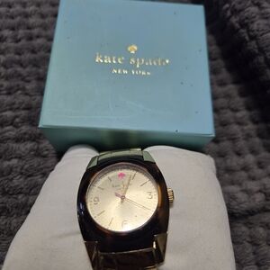 Kate Spade gold and tortoise watch original tags, box, and booklet.